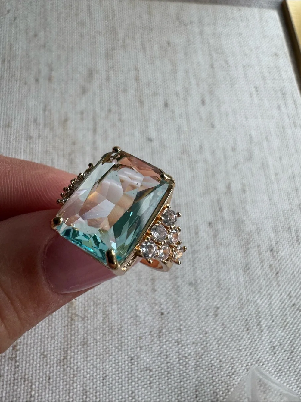 Stunning gold tone ring with blue crystal